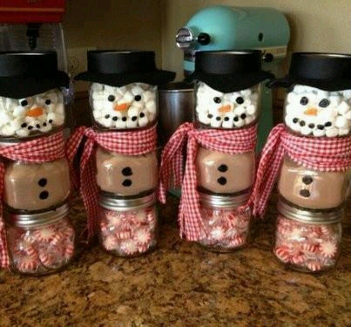 Snowman hot chocolate gifts: Three small jars, one filled with peppermints, one with hot chocolate mix, and one with marshmallows;