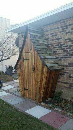 Such a lovely and whimsical garden/tool shed.