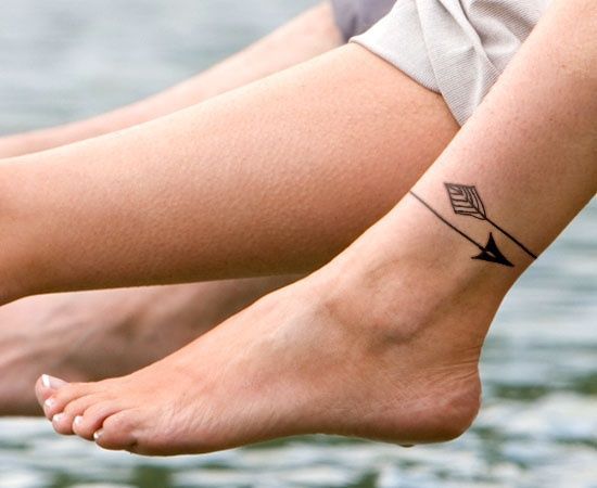 around the ankle tattoos | Woman with Arrow Tattoo around the Ankle