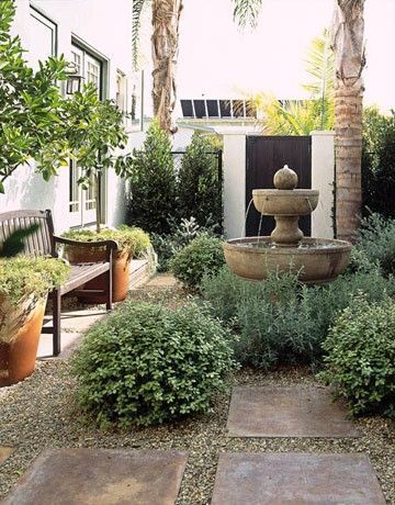 courtyard feel for cottage side garden…large pavers with gravel in between and low growing shrubs