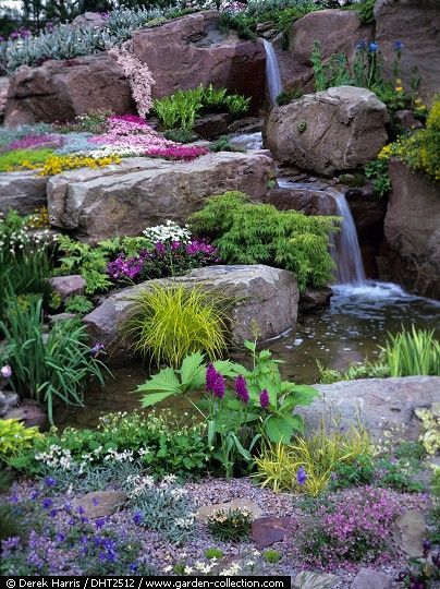 Good example of large water feature in an alpine setting done well. Stones and boulders should be of the same rock type/color and