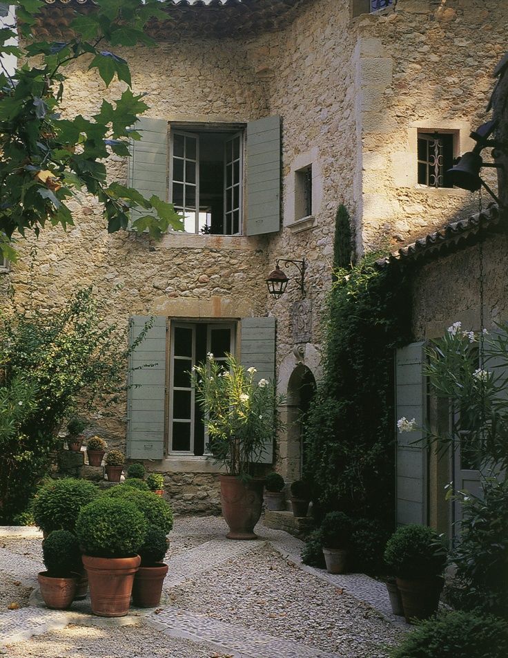 I love this color blue with the stone --I hope my next house is like this European Style Home & Courtyard Garden