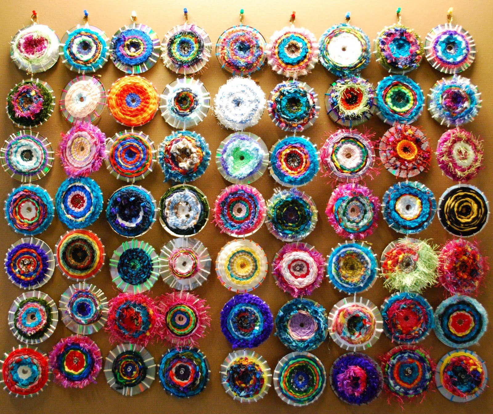 Amazing weavings on old CDs. What a great idea for the wall at the daycare in the older childrens room. They could take them home