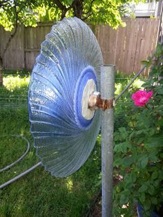 How to Attach a Glass Garden Flower to a Pole
