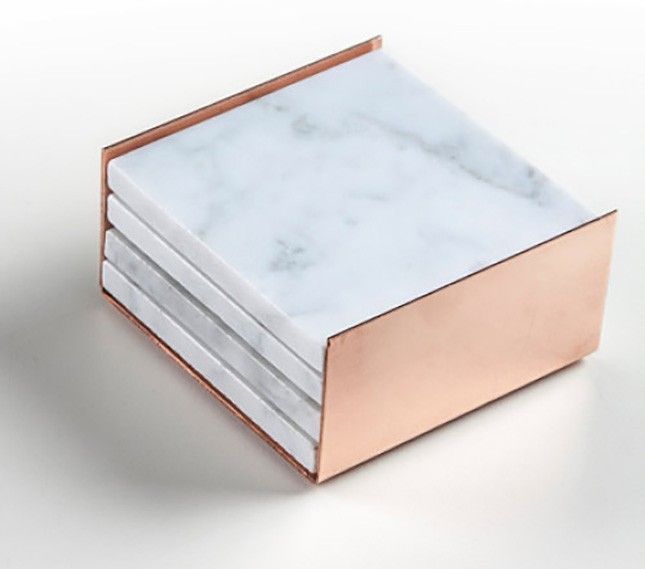 Inject some elegance into your home decor with a stack of marble + rose gold coasters.