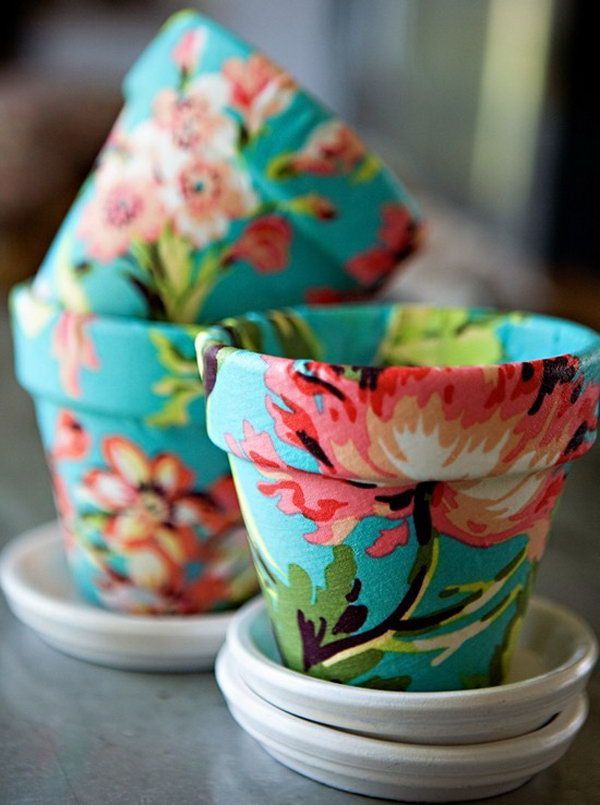 Mod Podge on Terra Cotta with Fabric. Grab some pretty fabric and Mod Podge to cover a flower pot bought at a garden center. A