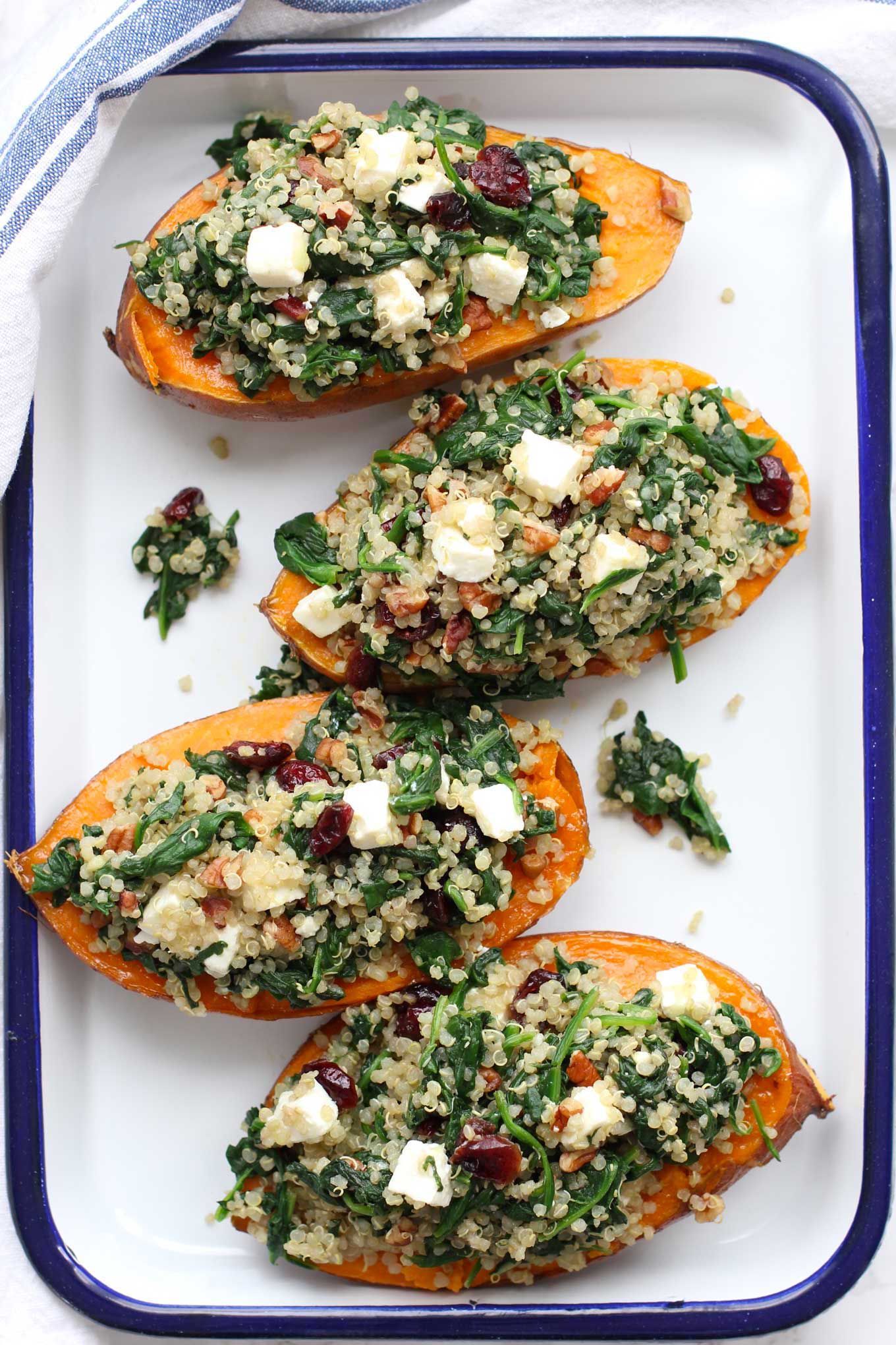 Roasted sweet potatoes stuffed with quinoa and spinach are a favorite fall dish. Its colorful, healthy and packed with flavor.