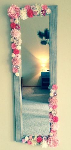 Teen decor -Hot glue small silk flowers on cheap over door mirror.
