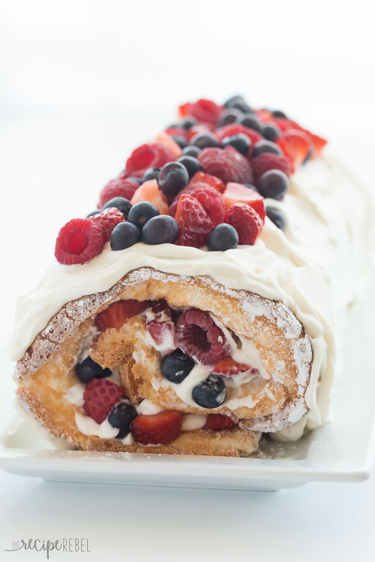 This Triple Berry Angel Food Cake Roll is an easy red, white and blue dessert (or just red and white!) for the 4th of July or