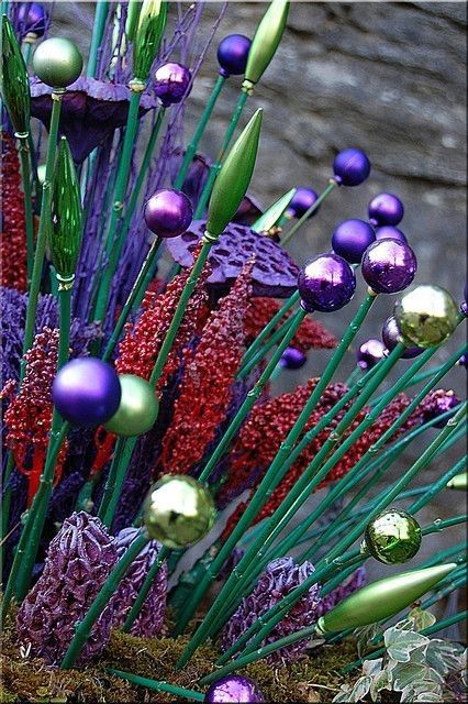Whimsy in the garden….old plastic christmas ornaments on a small painted dowel …what an easy idea :) garden yard art