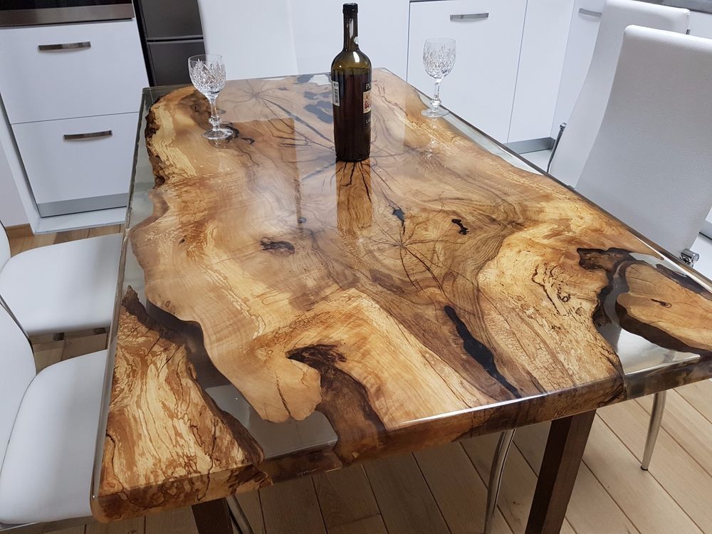 An exquisite and unique 6 person dining table,manually designed from the finest hornbeam wood with 12 layers of epoxy resin for