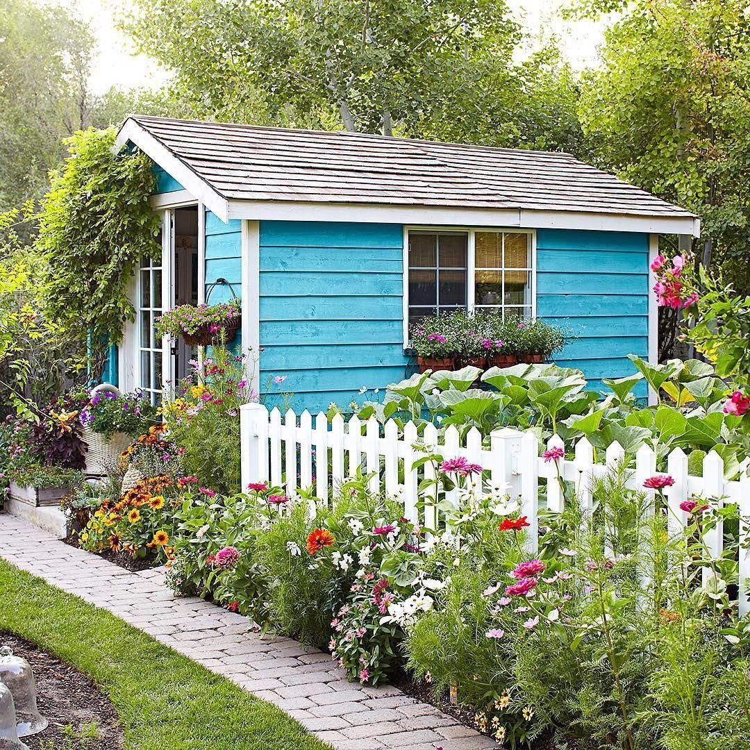 Aqua blue garden cottage shed with flowers Garden ideas and inspiration
