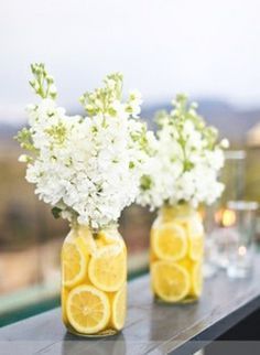 Flower idea with lemons for southern theme bridal shower. This would be pretty with other fruits too for the rehearsal dinner.