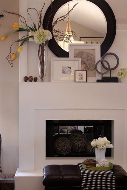 Love this simple fireplace and layering on the mantel.
