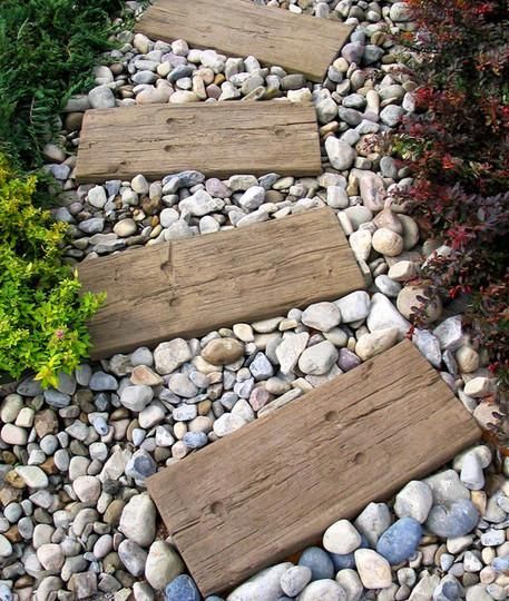 Railroad ties recycled to make garden foot steps. I’d love to find a way to use these in a pebble waterway.