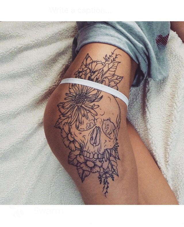 Skull + floral thigh tattoo… But prettier/softer.
