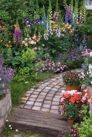 small lush cottage garden by eva.victoria1 love the soft looking square pavers.  can i do this with the portland cement???? by