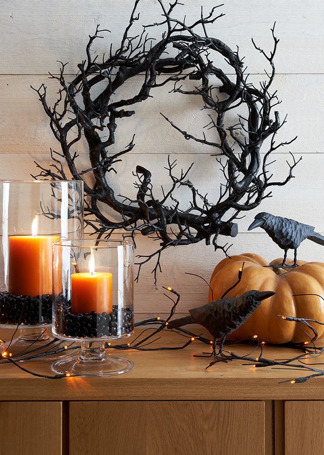 That gnarly looking wreath made of thick branches would make a nice and slightly spooky-looking Halloween decoration. Overall