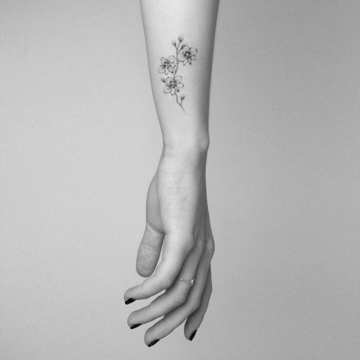smalltattoosco: “Hand poked orchid tattoo on the wrist. Tattoo artist: Lara M. J. ”