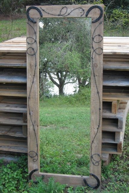 Dollar store mirror, frame it with old barn wood, detail with barb wire, and old horse shoes