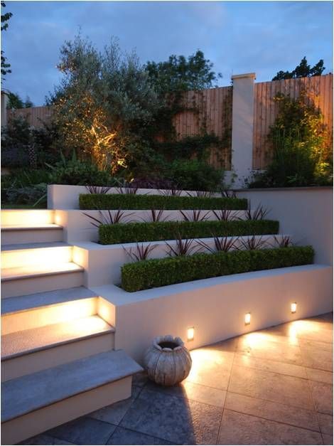 LD256s set into the planter walls on this project provide a glow of light to every other step leading up into the generous garden.