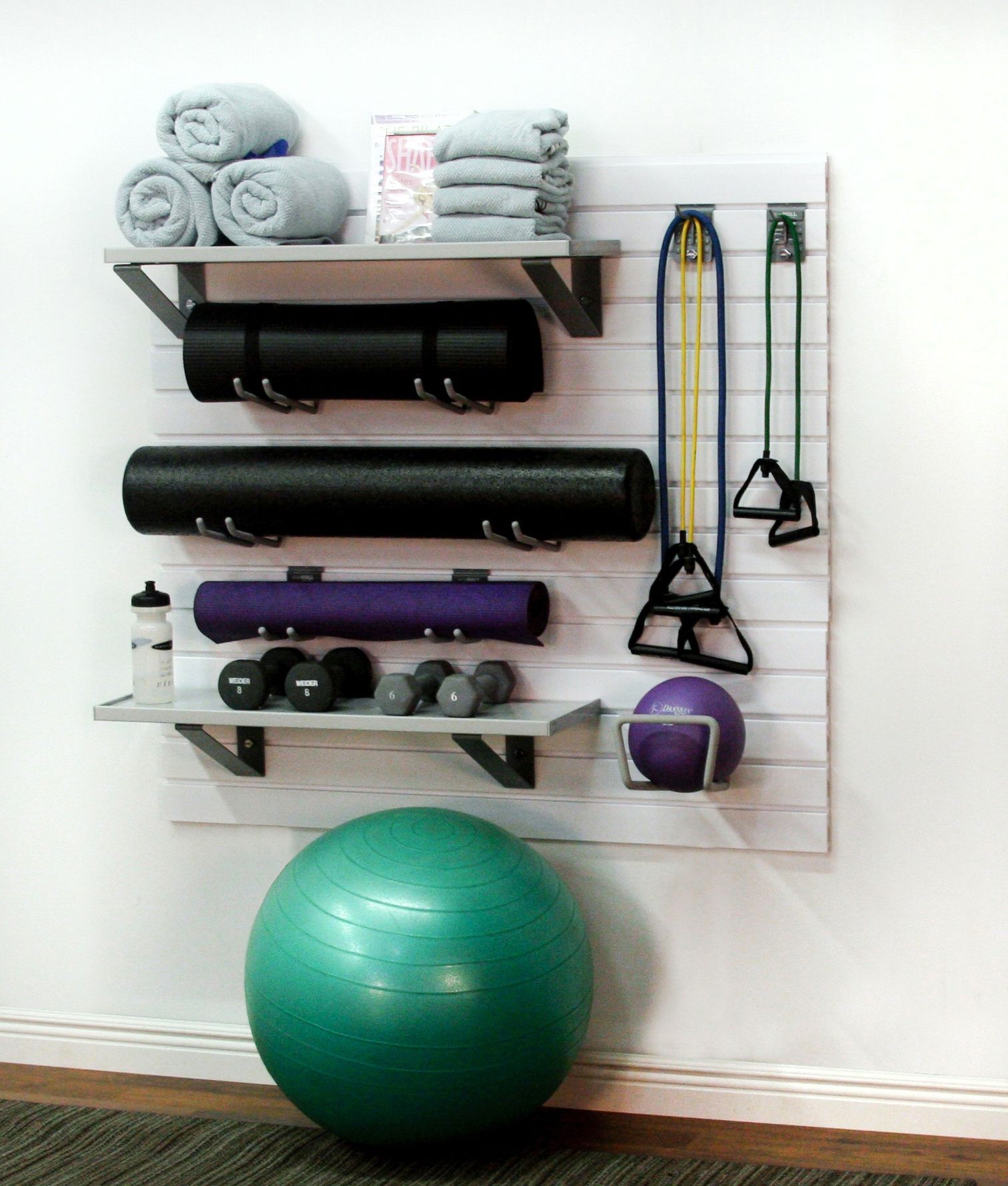 The storeWALL Home Fitness Equipment Storage Kit helps you create your own home gym oasis. Hold yoga mats, free weights, towels,
