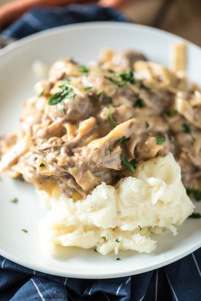 This Amish Beef and Noodles recipe can be made in a slow cooker or an Instant Pot. Served over mashed potatoes, it’s an easy and