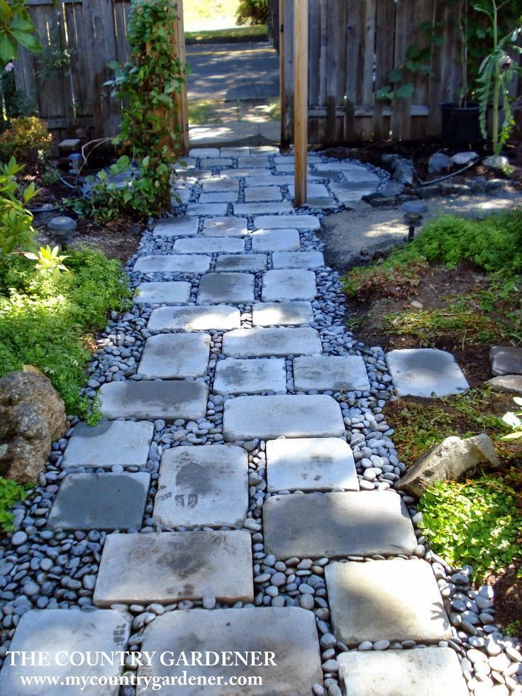 An inexpensive option for a beautiful path. Flagstones and river rock garden path