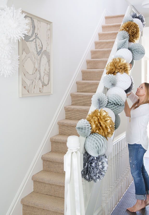 Festive paper pom pom garland. Photo by Ashley Capp and Valerie Wilcox (via Canadian House & Home).