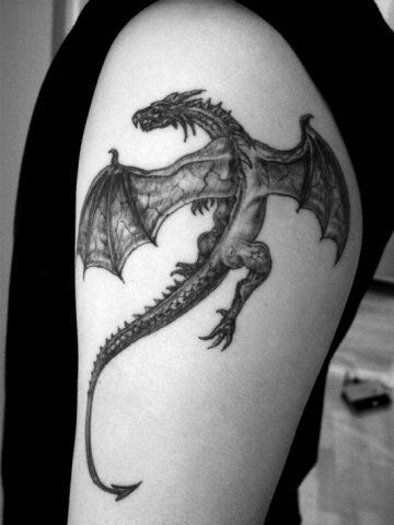 He looks just like my buddy. Must be his little one :) Realistic small dragon tatoo on shoulder – Dragon tattoos