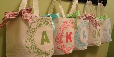 Make your own monogrammed tote bags using a doily and freezer paper. Use it as a gift or party favor bag instead of a paper one.