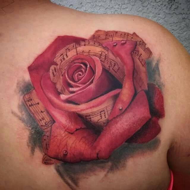 Musical rose tattoo by Mike Bush of Hallowed Point Tattoo in Palm Bay Florida. HallowedPointTattoo.com