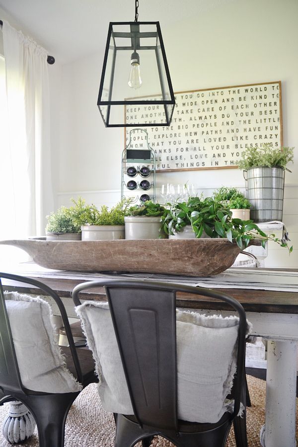 This style is a little too “industrial” for me, but I do like the light fixture, the metal planter accents and all of the green