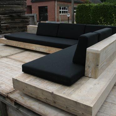 Timber seating with black cushions. A beautiful and timeless combination. Pinned to Garden Design – Outdoor Furniture by Darin