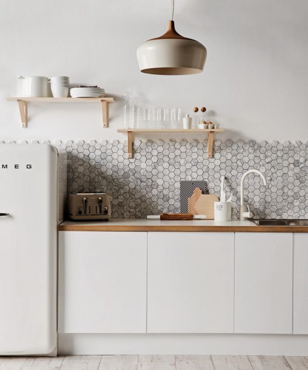 Beautiful simple kitchen. White, natural woods, varying grey honeycomb tiles, and a vintage fridge.