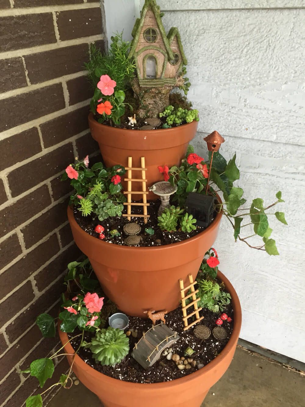 Get your kids to help you freshen up your curb appeal with this craft idea for a Tiered Front Porch Fairy Garden! By adding