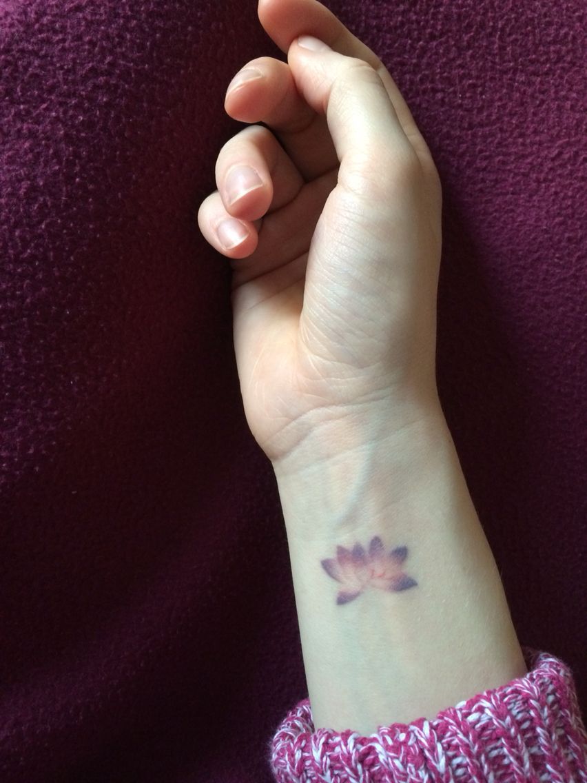 Small discreet lotus flower tattoo in purple and pink without outline #beautiful -   24 pink lotus tattoo
 ideas