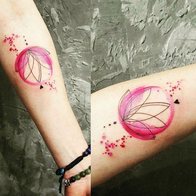 Choose a minimalist abstract lotus tattoo like this geometric-inspired one + add a bit of color with a watercolor circle for a unique look. -   24 pink lotus tattoo
 ideas