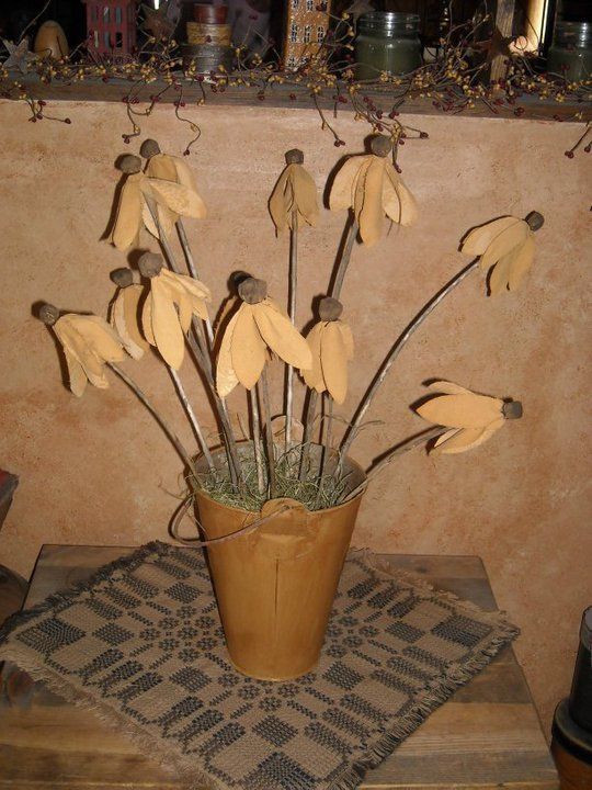Primitive Brown Eyed Susans ... I will be making these!!! Muslin flowers are painted and aged with walnut and clove. They are attached to real dried wood stems. Each flower measures approximately 15