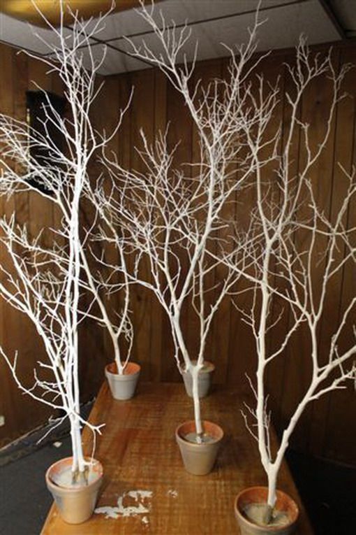 Spray paint branches white/silver and put in pots outside venue with fairy lights and snowflakes hanging off!!! -   24 winter decor lights
 ideas