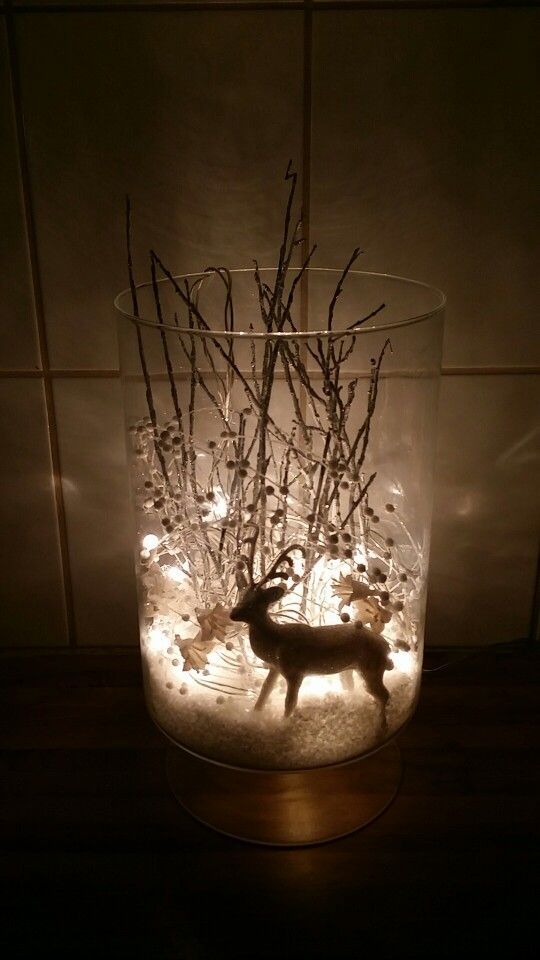 I took a vase, fake snow, a white glimmer reindeer, some silver tree branches, and some white pearl and flower decorations and some white christmas lights and made a winter wonderland to brighten up the dark days we are having here in Iceland -   24 winter decor lights
 ideas