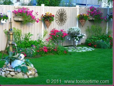 decorating a garden fence, love this idea very much!  wall art, birdhouses, etc...don't know if I could keep that many flowers alive but I could try! -   22 garden decor fence
 ideas
