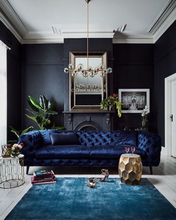Black walls, white ceiling and floor. Nice trim on ceiling. They must really hate their fireplace.  Lol. -   23 dark eclectic decor
 ideas