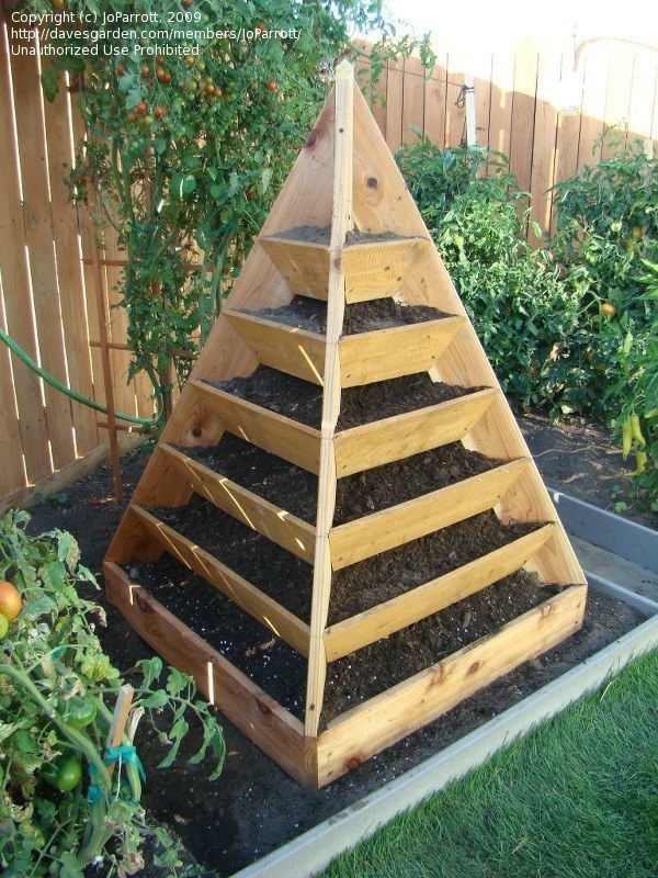 I LOVE this.  I wonder if you could plant each side with something different, like an herb side, a strawberry side, a salad side and a flower side? -   21 container garden strawberries
 ideas