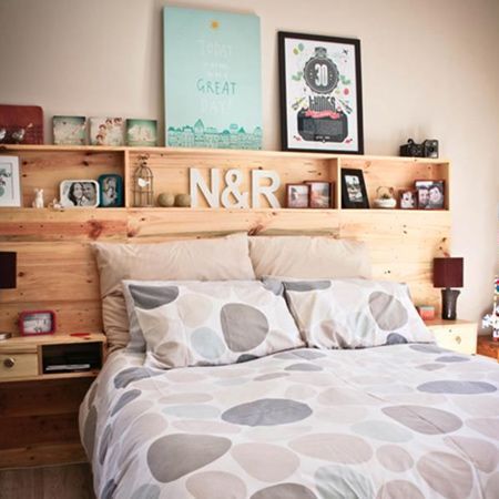 This pallet headboard is designed not only as a headboard but also to provide plenty of shelving for storage. Even the bedside shelves are built into the headboard -   21 diy storage headboard
 ideas