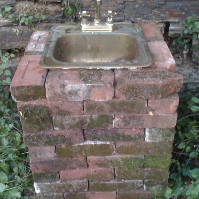 My outdoor sink made from savaged bricks, brass sink, and garden hose! www.placervillebedandbreakfast.com -   24 diy outdoor sink
 ideas