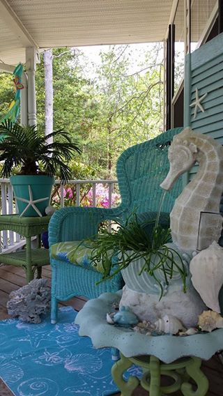 If my porch at the beach was big enough, this would be mine ... so pretty!  coastal porch seahorse fountain -   24 coastal decor patio
 ideas
