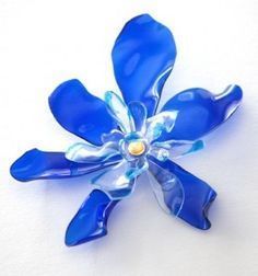 Plastic bottle flowers....made from bottles, colored with sharpie (if desired), melted with flame and hot glued together -   22 sharpie crafts plastic
 ideas