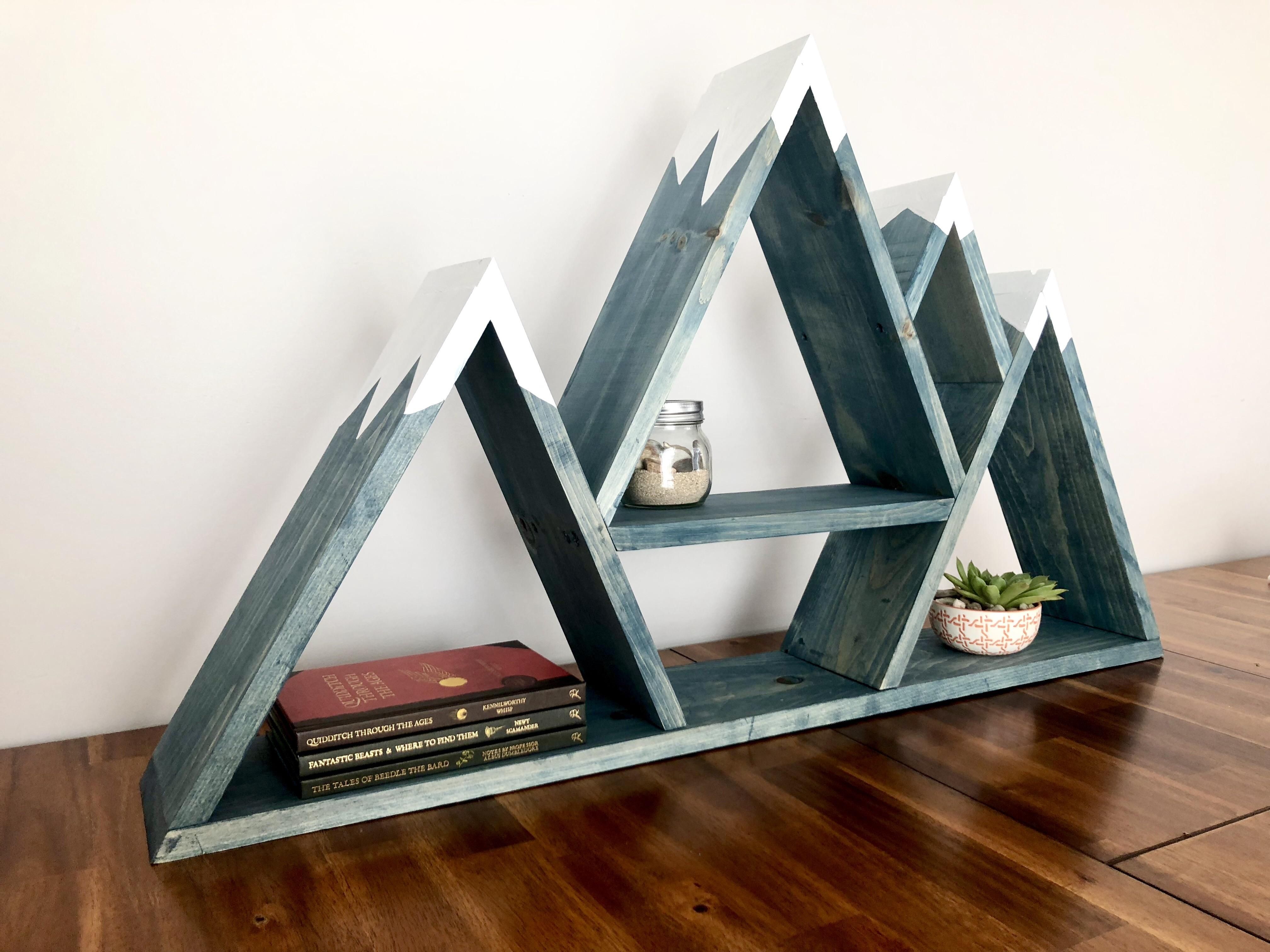 My husband made this mountain shelf as a gift for a baby shower. Its his first try at woodworking and Im so proud! -   22 mountain house decor
 ideas