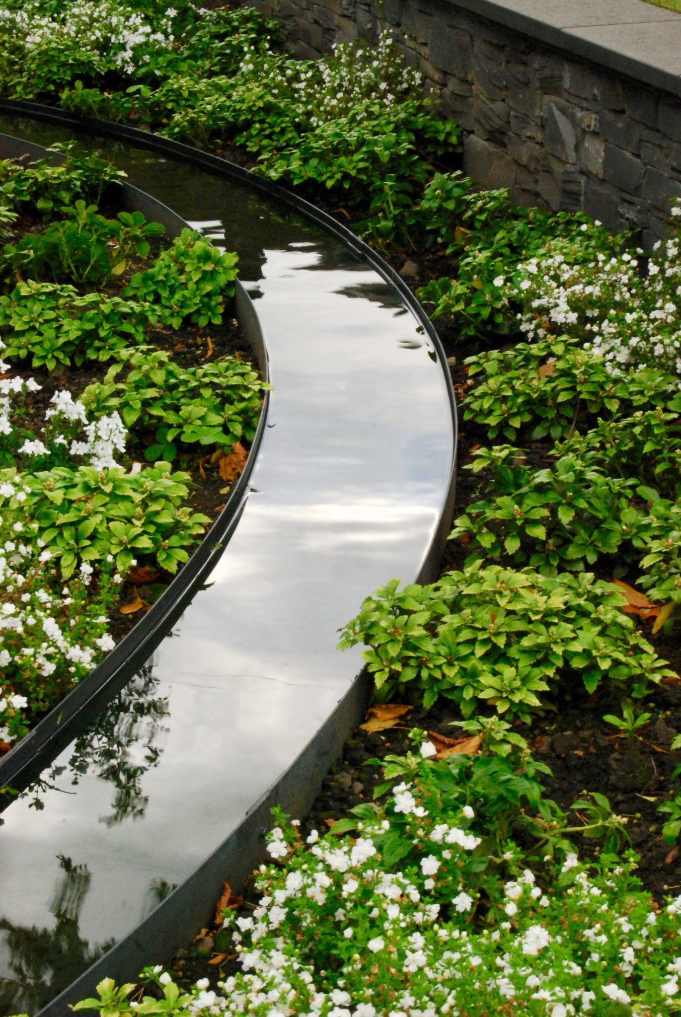 Metal rill water feature detailing creates a beautiful reflective element to your garden -   24 garden design water
 ideas